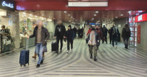 Three wide, clear underpasses lead up from platform to the hall.